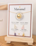 Bola de grossesse or avec 4 pendentifs en pierres naturelles